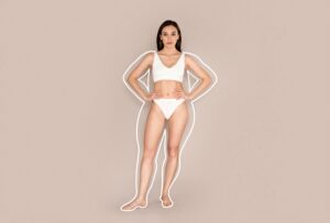 Woman in undergarments with smaller body shape after minimally invasive body procedures