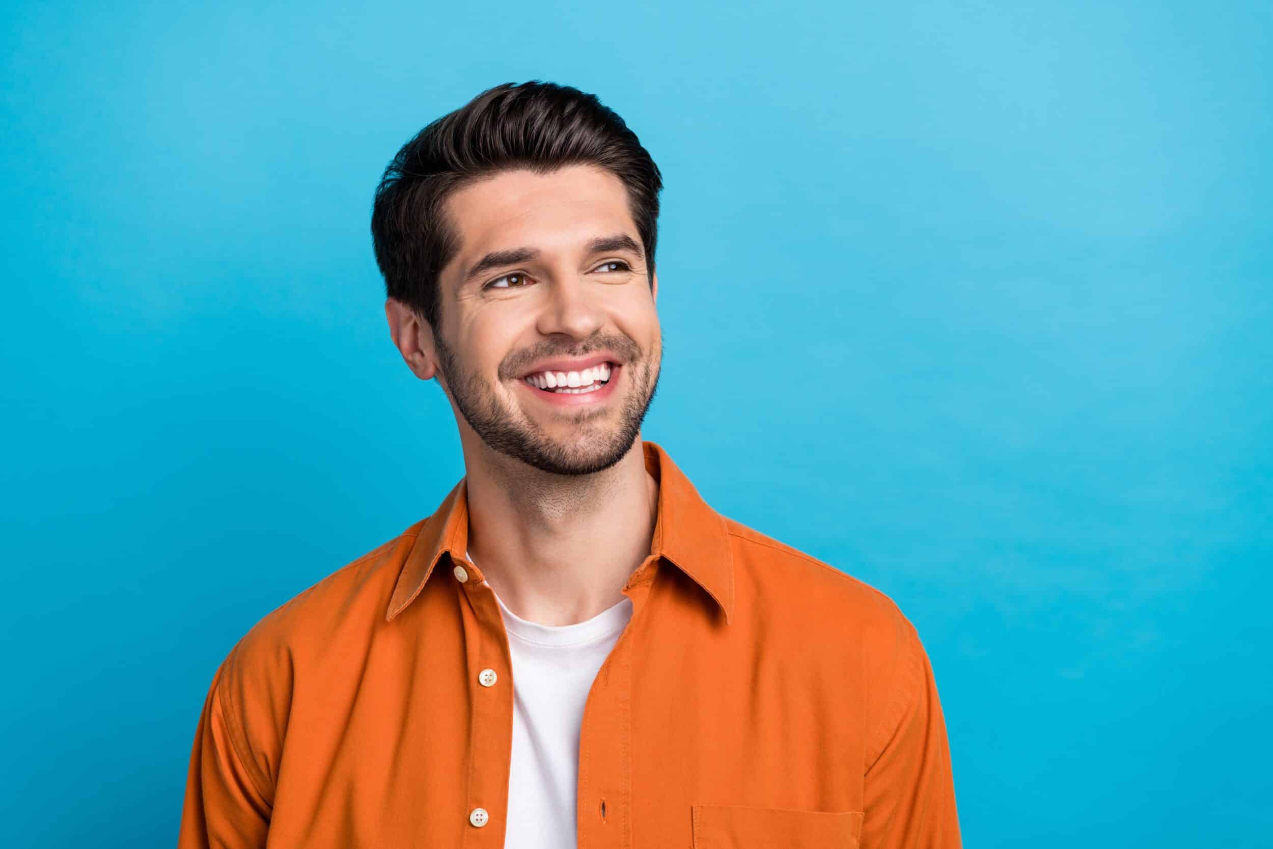 A man smiling after getting penile enhancement with fillers in Chicago