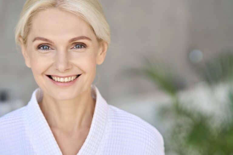 Smiling woman representing dermal filler results at Old Town Med Spa.