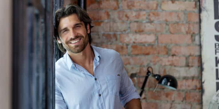 Dr. Nael Gharbi smiling in a casual setting.