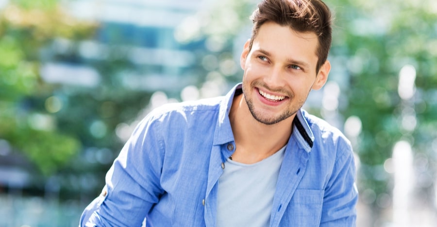 Smiling man outdoors, representing Old Town Med Spa services.
